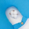 Travel pillow made of organic cotton with hypoallergenic down filling in blue color
