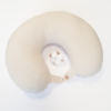 Travel pillow made of organic cotton with hypoallergenic down filling in off white color