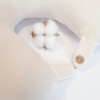Travel pillow made of organic cotton with hypoallergenic down filling in off white color