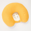 Travel pillow made of organic cotton with hypoallergenic down filling in yellow color