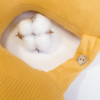 Travel pillow made of organic cotton with hypoallergenic down filling in yellow color