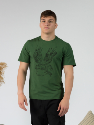 Young man wearing organic cotton green color t-shirt with colored print and black trousers