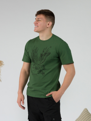 Young man wearing organic cotton green color t-shirt with colored print and black trousers
