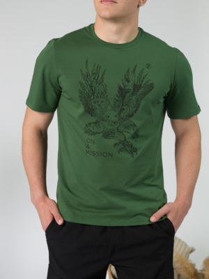 Young man wearing organic cotton green color t-shirt with colored print and black trousers