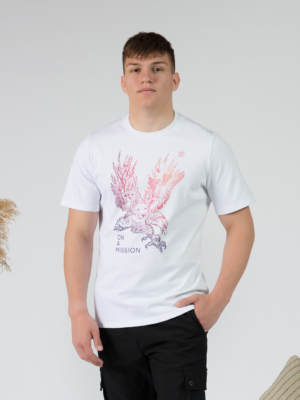 Young man wearing organic cotton white color t-shirt with colored print and black trousers