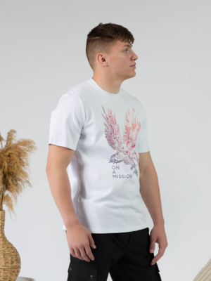 Young man wearing organic cotton white color t-shirt with colored print and black trousers