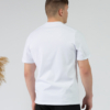 Young man wearing organic cotton white color t-shirt with colored print and black trousers