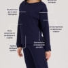 woman with blond hair wearing dark blue organic cotton long sleeve off shoulder boat neck blouse and dark blue organic cotton long tapered leg pants