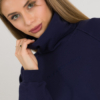 woman with blond hair wearing dark blue organic cotton oversized polo collar sweatshirt