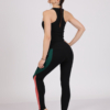 Women with brown hair is wearing black organic cotton tank top and multicolored organic cotton leggings