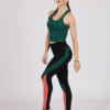 Women with brown hair is wearing green organic cotton tank top and multicolored organic cotton leggings