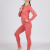 Women with brown hair is wearing pink organic cotton long sleeve top and pink organic cotton leggings