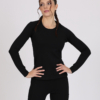 Women with brown hair is wearing black organic cotton long sleeve top and black organic cotton leggings