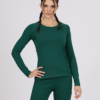 Women with brown hair is wearing dark green organic cotton long sleeve top and dark green organic cotton leggings