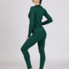 Women with brown hair is wearing dark green organic cotton long sleeve top and dark green organic cotton leggings