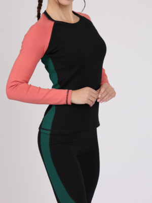 Women with brown hair is wearing multicolored organic cotton long sleeve top and multicolored organic cotton leggings