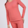 Women with brown hair is wearing pink organic cotton long sleeve top and pink organic cotton leggings