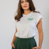 Woman wearing dark green organic cotton pants and white organic cotton t-shirt with embroidery "proud outfit reperater