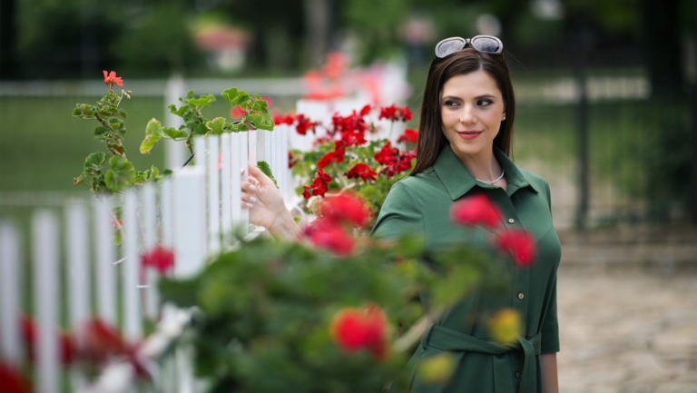 Woman in a green organic cotton dress