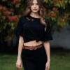 Woman wearing black organic cotton pants and black organic cotton t-shirt with embroidery "Let it bee"