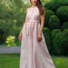 Dark-haired woman wearing a pink jumpsuit with wide legs made of lyocell and linen