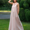 Dark-haired woman wearing a pink jumpsuit with wide legs made of lyocell and linen