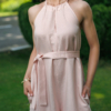 Dark-haired woman wearing a pink jumpsuit with wide legs made of lyocell and linen