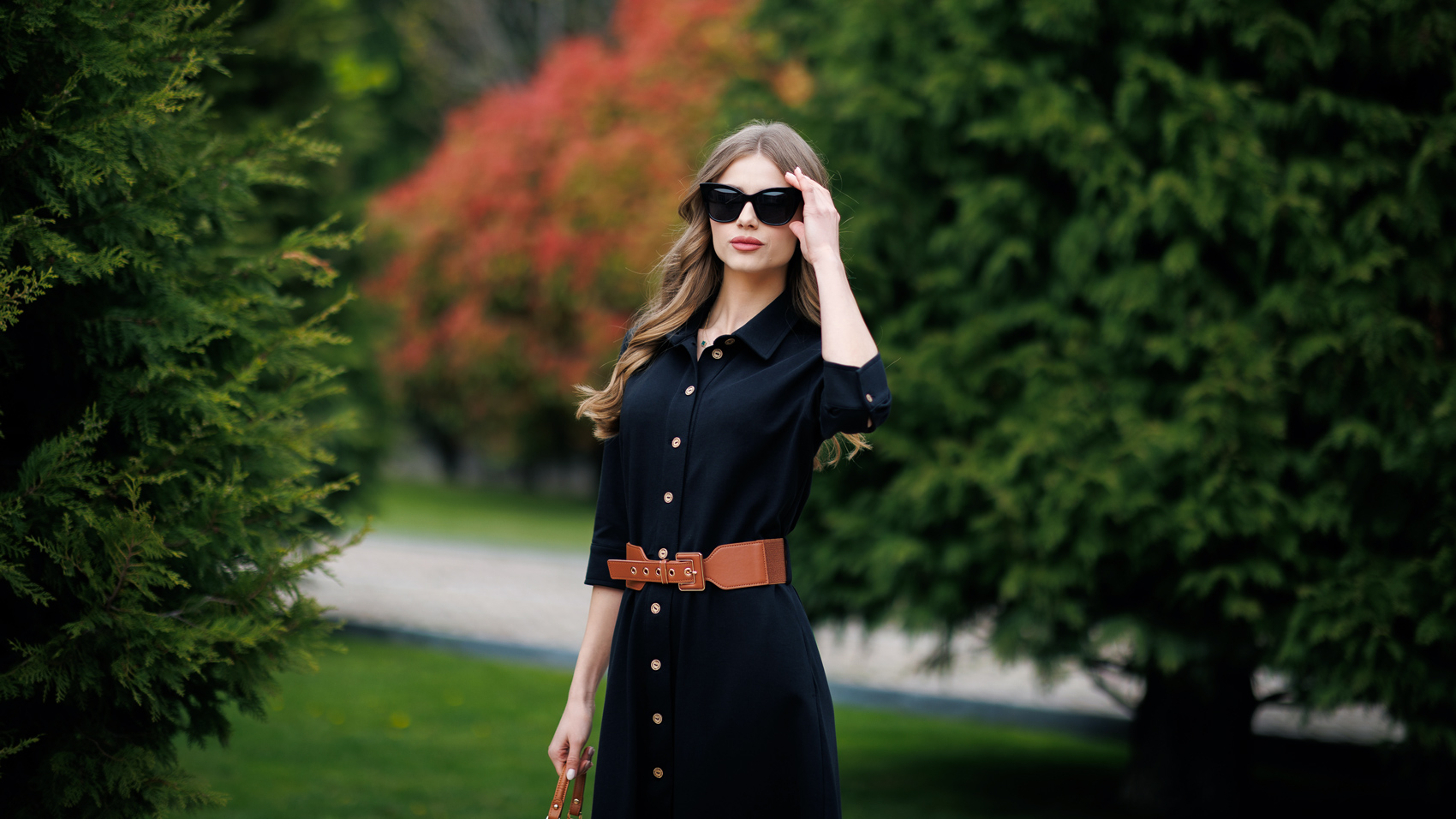 Woman in a black organic cotton dress